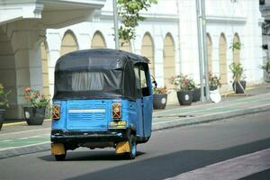 jakarta, indonesia-23 april 2023 means of transportation from Indonesia namely bajaj photo