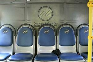 Jakarta, Indonesia-18 June 2023 Transjakarta bus seats with the theme of Transjakarta bus interiors photo