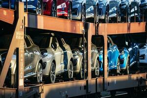 New Ford Puma ST-Line 2021. Creative sunset low light photoshoot. Part of a massive 500 car freight train. photo