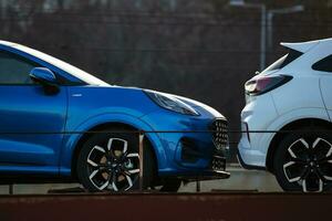 New Ford Puma ST-Line 2021. Creative sunset low light photoshoot. Part of a massive 500 car freight train. photo