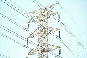 central electricity pylon with clear sky background photo