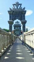 A stone bridge gateaway with ornament photo