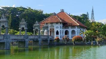 A historical building on the lake with bridge photo