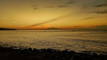 Sunrise morning in the beach with mountain view photo