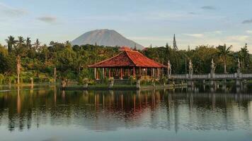 A historical building on the lake with bridge photo