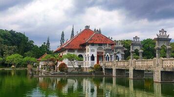 A historical building on the lake with bridge photo