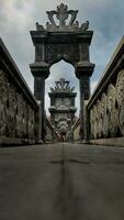 A stone bridge gateaway with ornament photo