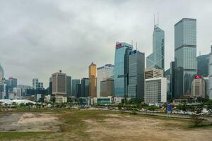 Hong Kong,March 25,2019-View of the Hong Kong skyscrapers near the ferris wheel on a cloudy day photo