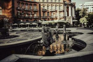 Old fountain with stone oriental statue of one of the streets of Yerevan. photo