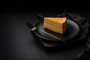 Delicious fresh sweet honey cake layer cake with white cream photo