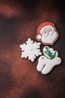 Beautiful delicious Christmas gingerbread on a concrete texture background photo