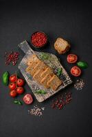 Delicious salted rectangular wheat croutons with salt and spices photo
