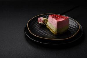 Delicious sweet dessert cheesecake with raspberry and pistachio flavor photo