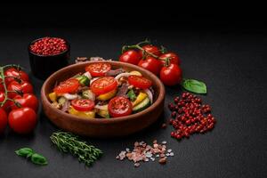 Delicious fresh salad with beef slices, cherry tomatoes, sweet peppers photo