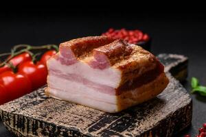 Delicious calorie smoked bacon with salt, spices and herbs photo