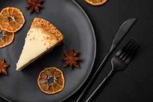 Delicious sweet cheesecake cake on textured concrete background photo