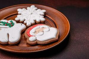 Beautiful delicious Christmas gingerbread on a concrete texture background photo