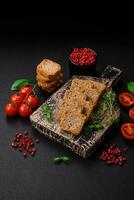 Delicious salted rectangular wheat croutons with salt and spices photo
