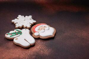 Beautiful delicious Christmas gingerbread on a concrete texture background photo