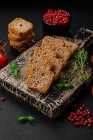 Delicious salted rectangular wheat croutons with salt and spices photo