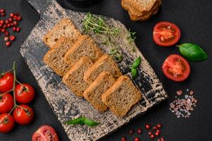 Delicious salted rectangular wheat croutons with salt and spices photo