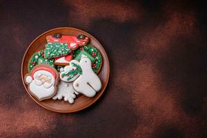 Beautiful delicious Christmas gingerbread on a concrete texture background photo