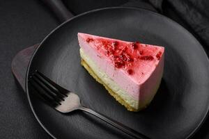 Delicious sweet dessert cheesecake with raspberry and pistachio flavor photo