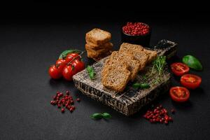Delicious salted rectangular wheat croutons with salt and spices photo