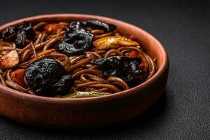 Delicious fresh buckwheat noodles or udon with mushrooms, peppers and other vegetables photo