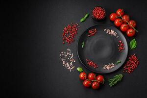 Ingredients for cooking cherry tomatoes, salt, spices and herbs photo