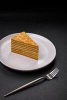 Delicious fresh sweet honey cake layer cake with white cream photo