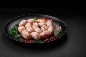 Fresh raw sausages from pork or chicken with salt, spices and herbs photo