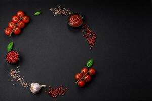 Ingredients for cooking cherry tomatoes, salt, spices and herbs photo