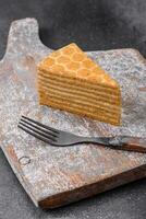 Delicious fresh sweet honey cake layer cake with white cream photo