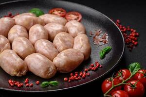 Fresh raw sausages from pork or chicken with salt, spices and herbs photo