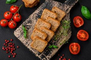 Delicious salted rectangular wheat croutons with salt and spices photo