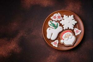 Beautiful delicious Christmas gingerbread on a concrete texture background photo