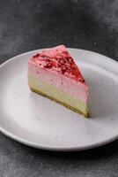 Delicious sweet dessert cheesecake with raspberry and pistachio flavor photo