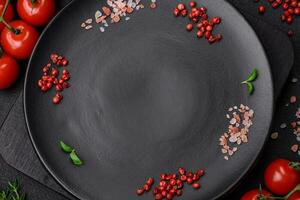 Ingredients for cooking cherry tomatoes, salt, spices and herbs photo