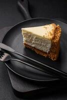 Delicious sweet cheesecake cake on textured concrete background photo