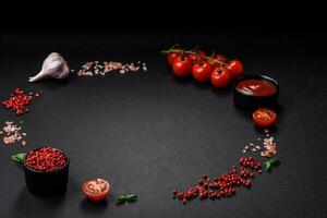 Ingredients for cooking cherry tomatoes, salt, spices and herbs photo