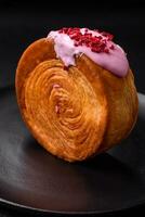 Round puff pastry croissant with raspberry filling or new york roll photo