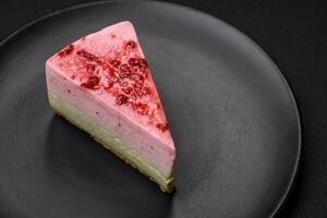 Delicious sweet dessert cheesecake with raspberry and pistachio flavor photo