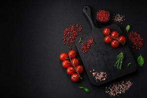 Ingredients for cooking cherry tomatoes, salt, spices and herbs photo