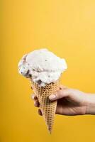 Woman eating yummy ice cream - yellow background photo