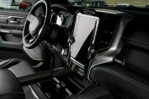 luxurious truck interior, steering wheel, leather seats and touchscreen display photo