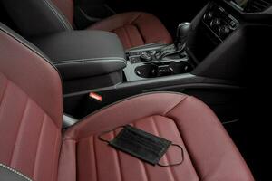 coronavirus mask inside a luxury car, leather seats photo