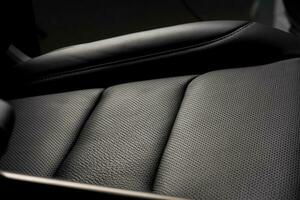 Closeup shot of the black seat surface inside a car photo