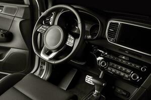 New car steering wheel, luxurious details in black leather photo