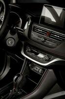 Modern new car interior with digital touch screen and automatic gear stick, safety and comfort concept photo